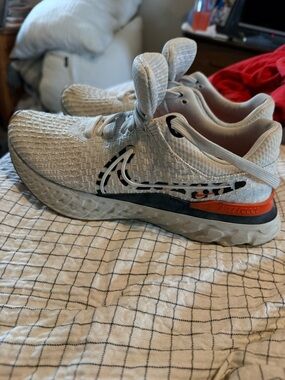 Women’s Nike Neutral White Athletic Sneakers with Orange Accent